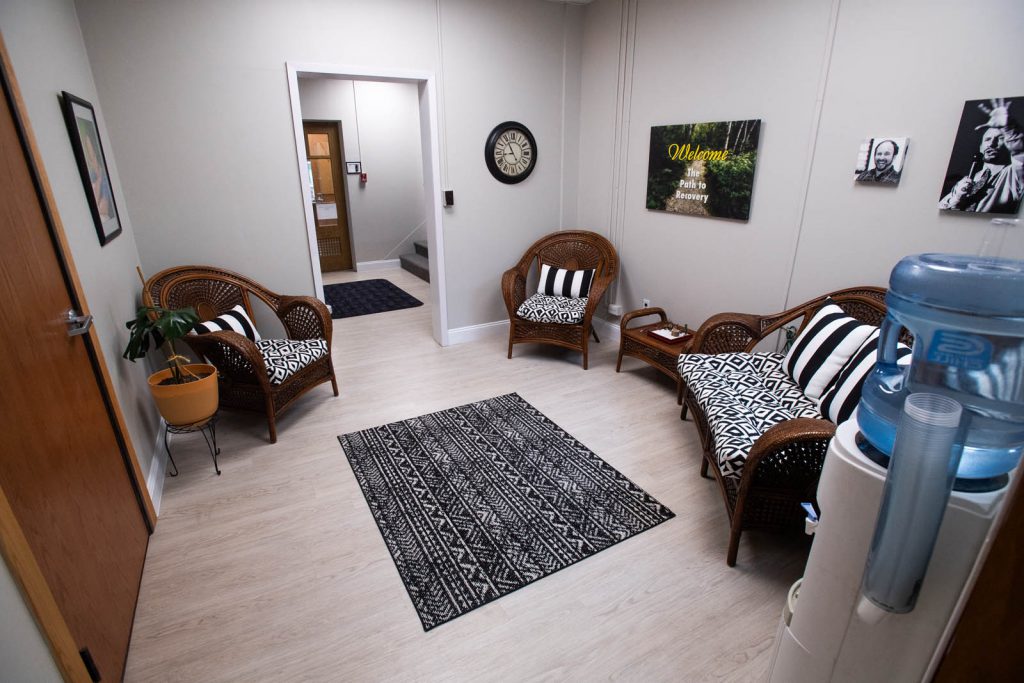 A waiting room with three chairs at the wellstone center for recovery.