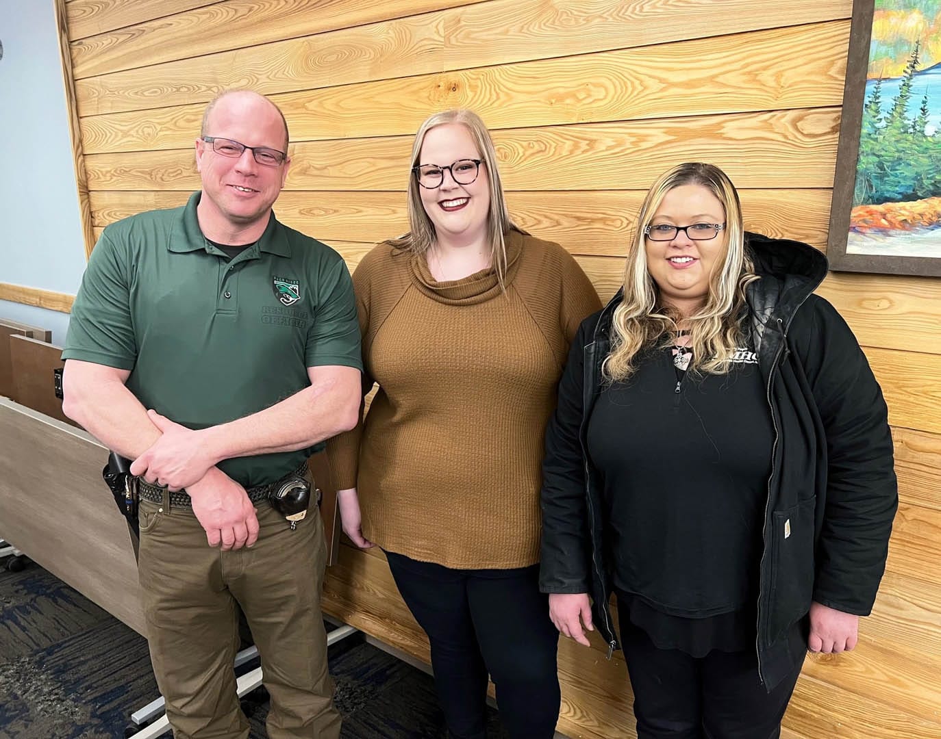 Three individuals from the CCRT Team smile and look at the camera.